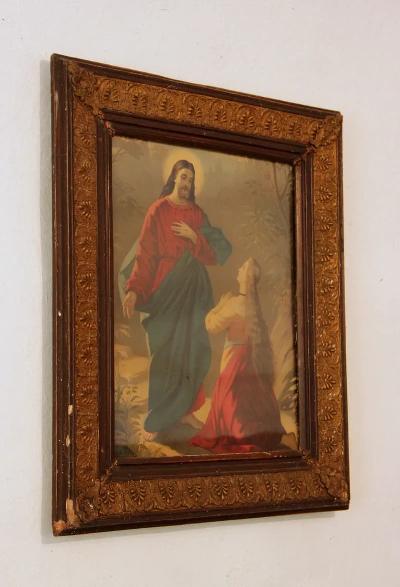 Large holy picture in a frame: perhaps a depiction of Mary Magdalene