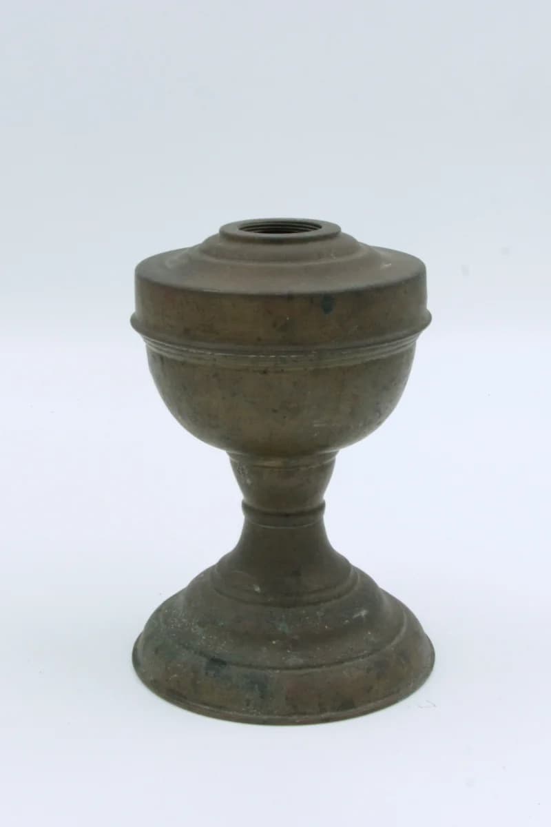 Base of a kerosene lamp